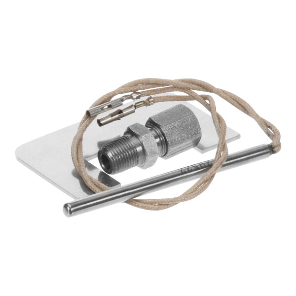 A silver metal pipe with a wire attached to it.