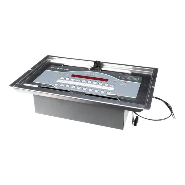A rectangular metal box with a digital screen and buttons on the top.