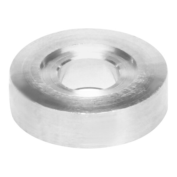 A close-up of a round stainless steel Henny Penny breading machine wheel spacer with a hole in it.