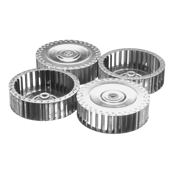 A close-up of a metal wheel with circular holes.