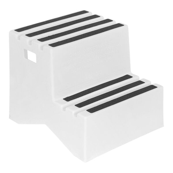 A white step stool with black rubber inserts.