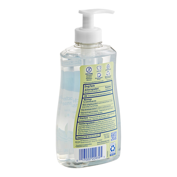 A bottle of Dial White Tea liquid hand soap with a label.