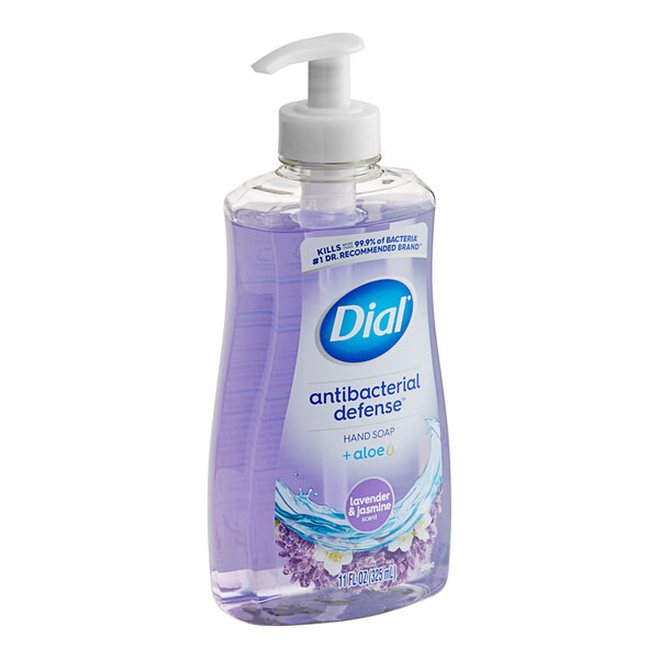 A bottle of Dial antibacterial hand soap with lavender and jasmine on a counter.