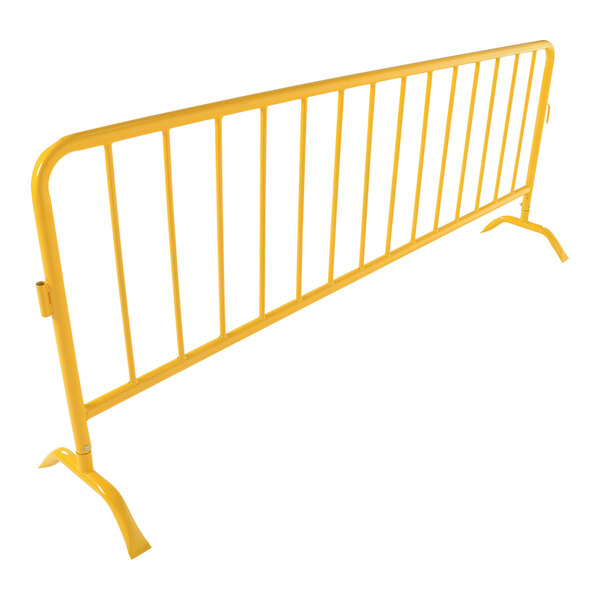 A yellow metal crowd control barrier with curved feet.