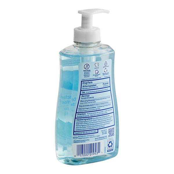 A bottle of Dial Spring Water liquid hand soap with blue liquid.