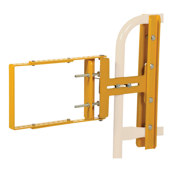 A yellow galvanized steel self-closing gate with a metal bracket and tubes.