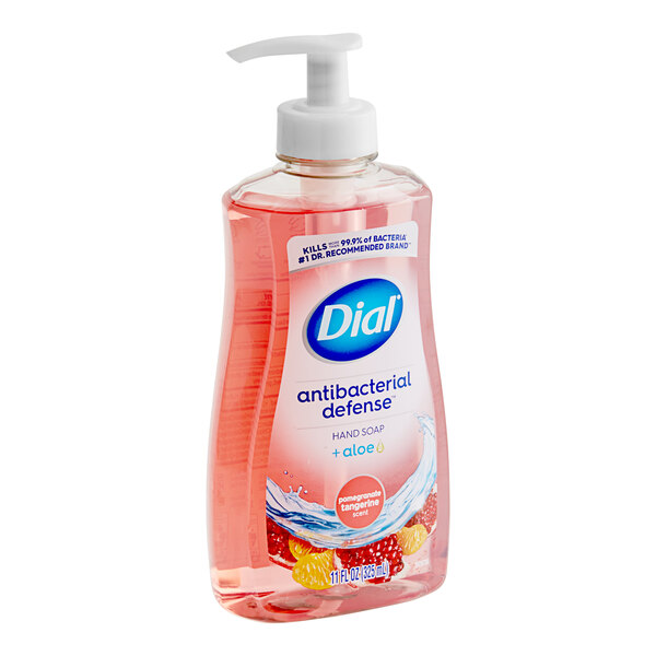 A case of 12 Dial Pomegranate Tangerine Liquid Hand Soap bottles on a counter.
