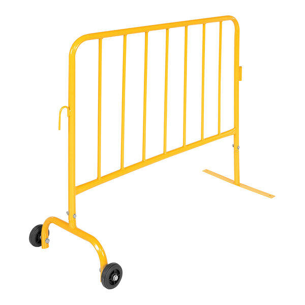 A yellow metal Vestil crowd control barrier with wheels.