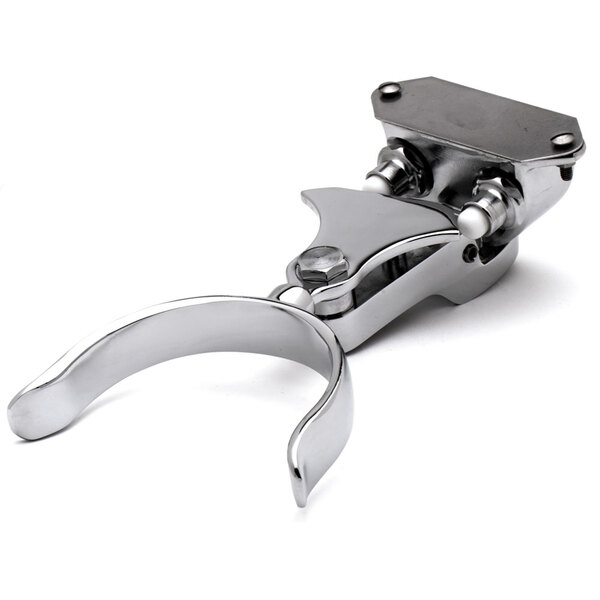 A silver metal T&S Delrin push button with screws.