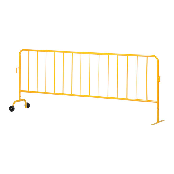 A yellow metal fence with wheeled and flat feet.