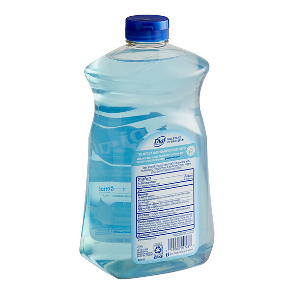 A close-up of a Dial Complete Spring Water Liquid Hand Soap refill bottle with a blue cap and label.