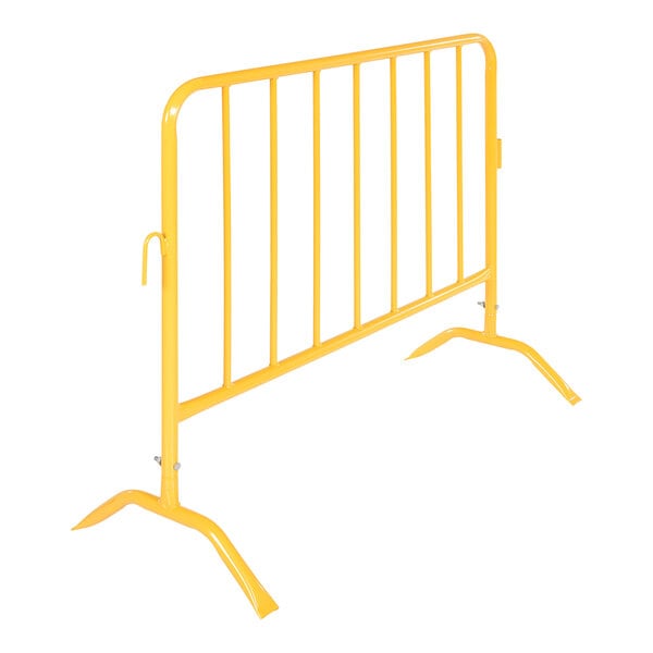 A yellow metal crowd control barrier with curved feet.