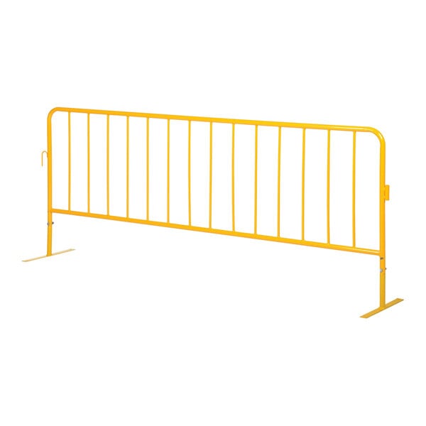 A yellow steel crowd control barrier with flat feet.