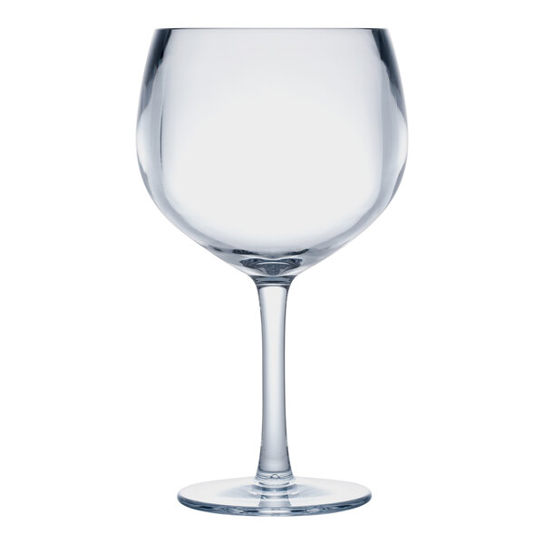 A clear plastic gin and tonic glass with a stem.