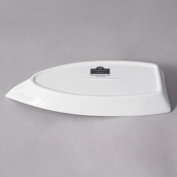 A white porcelain oval-shaped sushi boat.