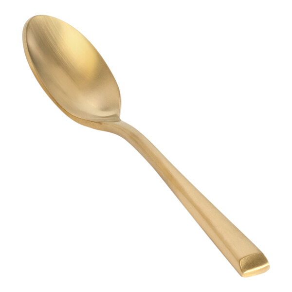 A Front of the House Matte Brass Demitasse Spoon with a golden handle.