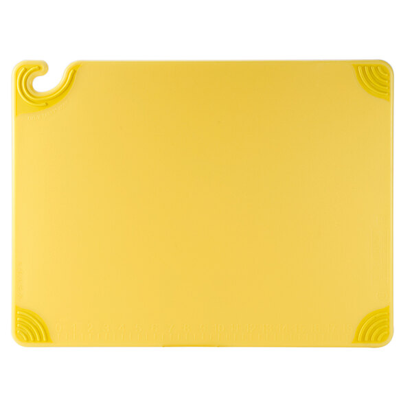 A yellow plastic cutting board with a hook.