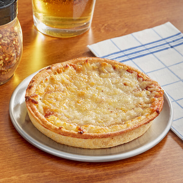 A Tony's deep dish whole grain cheese pizza on a plate.