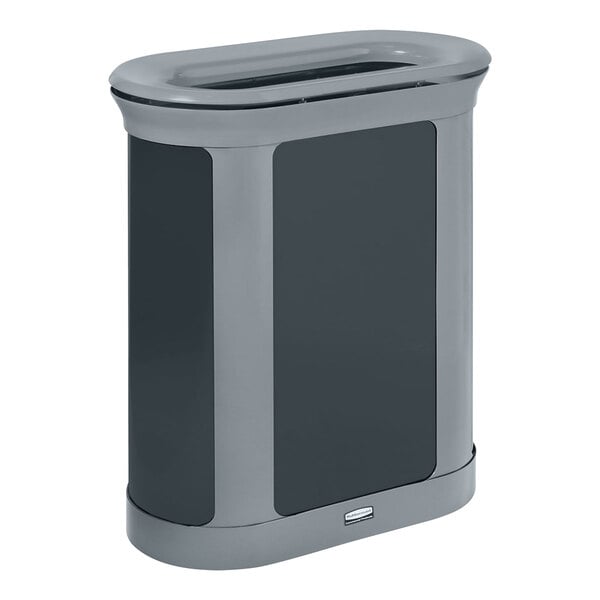 A grey oval Rubbermaid waste receptacle with a black lid.