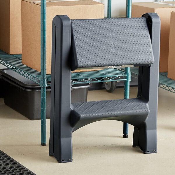 A gray Lavex two-step folding step stool.
