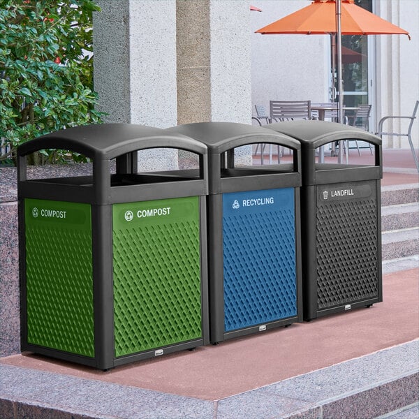 A green and black Rubbermaid compost panel.