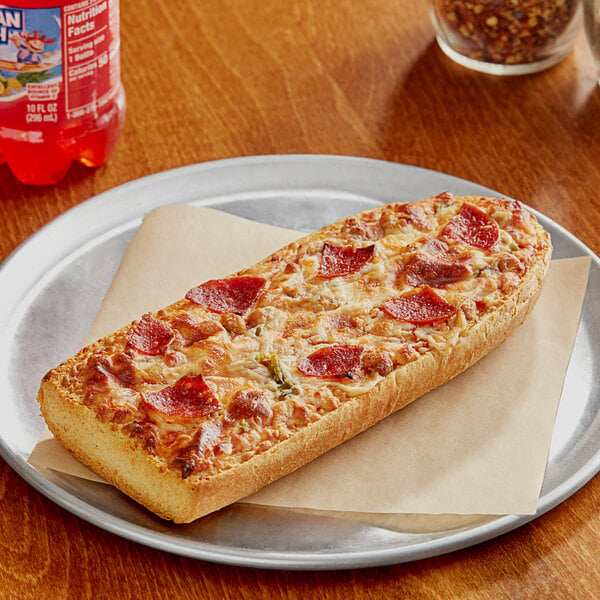 A Red Baron Supreme French Bread pizza on a plate.