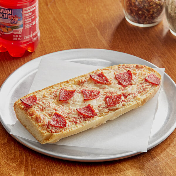 A Red Baron pepperoni French bread pizza on a plate.