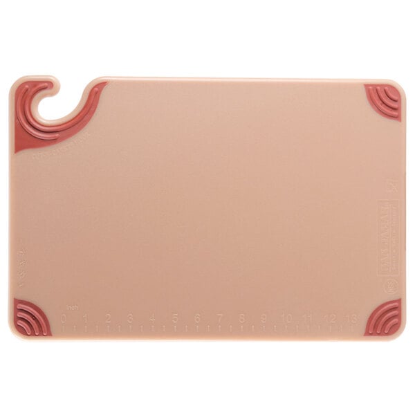 A brown San Jamar plastic cutting board with a red edge and hook.