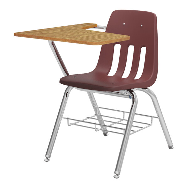 A Virco student desk with medium oak tablet arm and underseat book rack.