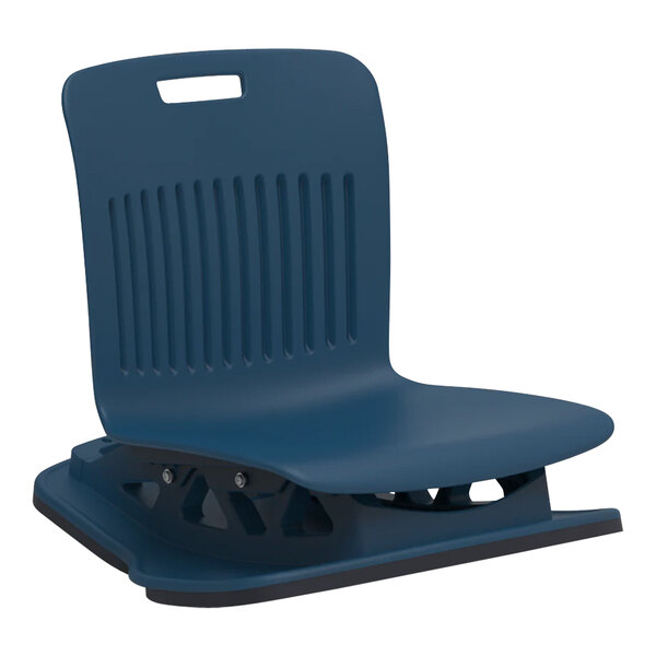 A navy plastic Analogy floor rocker chair shell on a metal base.