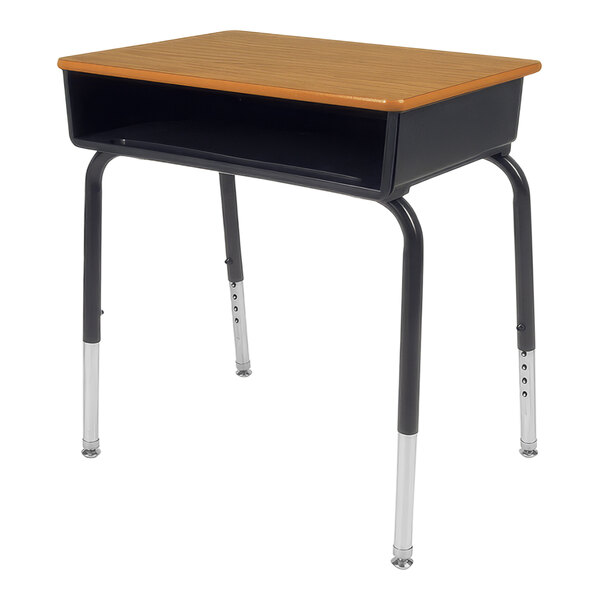 A medium oak open-front school desk with a metal frame and a wooden top.