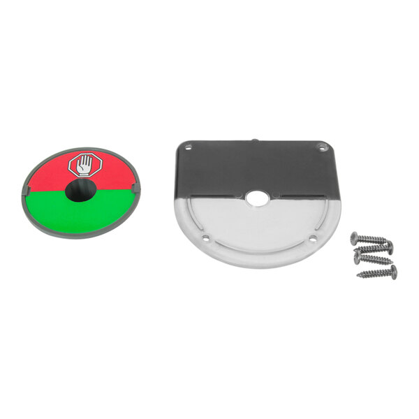 A circular black and red indicator plate with screws.