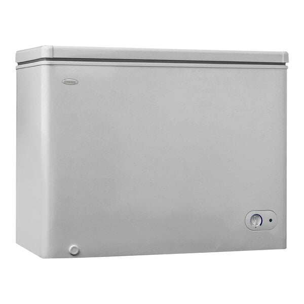 A white Danby chest freezer with a button on the side.