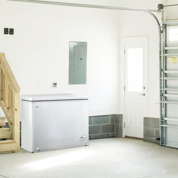 A Danby white chest freezer with a lid.