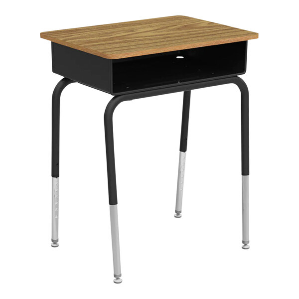 A wooden student desk with metal open-front book boxes and adjustable legs.