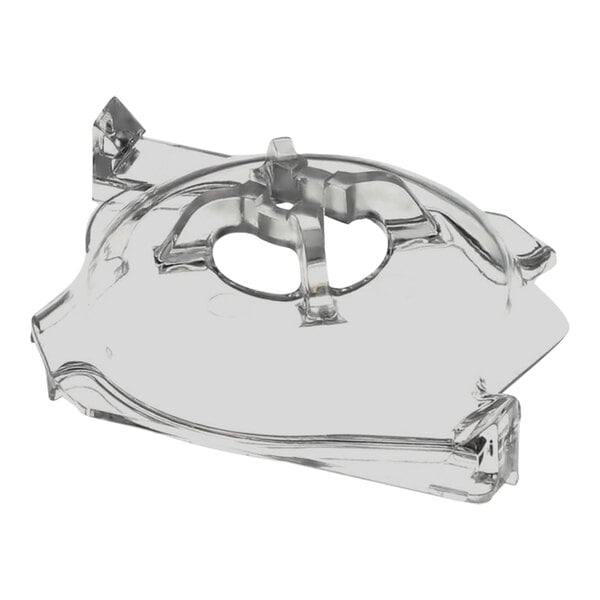 A clear plastic Grindmaster inner pump cover with holes in it.