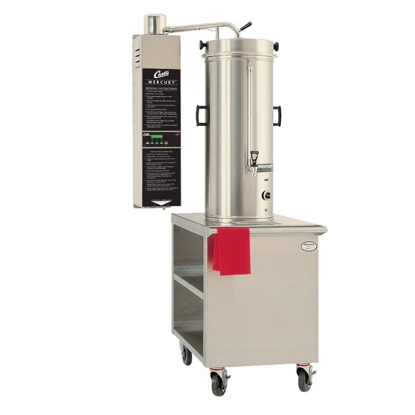 A stainless steel Curtis Mercury Dual Service Coffee Dispenser with a red lid.