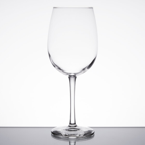 A clear Libbey Vina wine glass on a white table.