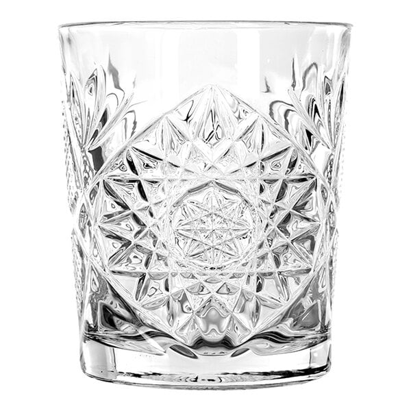 A clear glass with an intricate starburst pattern, designed for serving rocks or double old fashioned drinks.