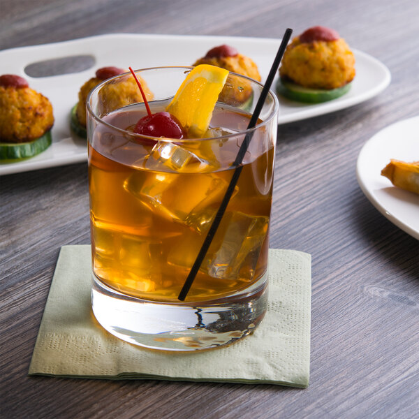 A Reserve by Libbey Modernist double old fashioned glass with a drink and a cherry on top.