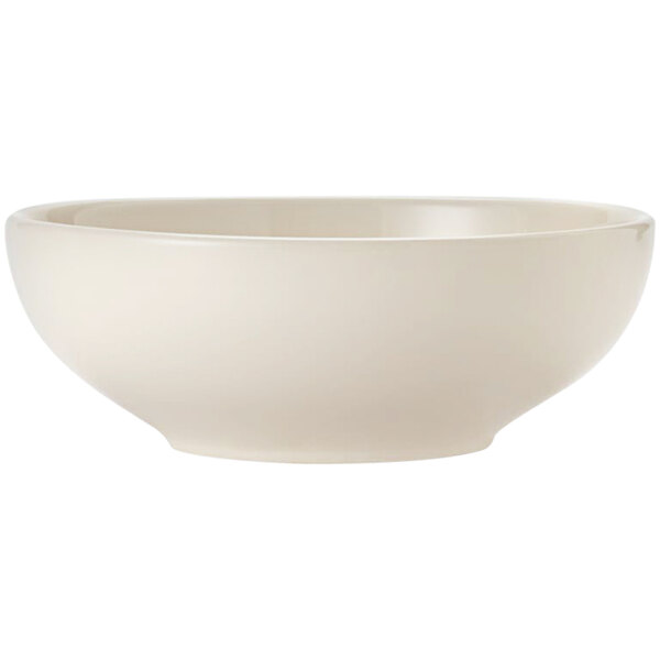 A Libbey Porcelana cream white porcelain pasta bowl with a rolled edge.