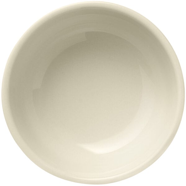 A Libbey Porcelana cream white nappie bowl with a rolled edge.