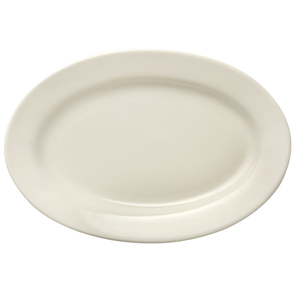 A Libbey Porcelana cream white oval platter with a wide rim.