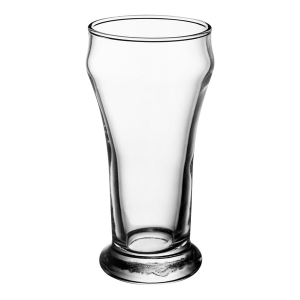 A close-up of a Libbey clear Pilsner glass with a base.