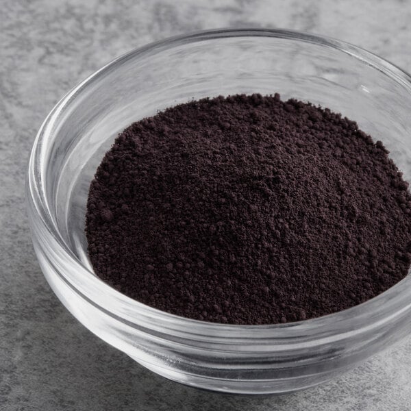 A bowl of Chefmaster black dry powder food color.