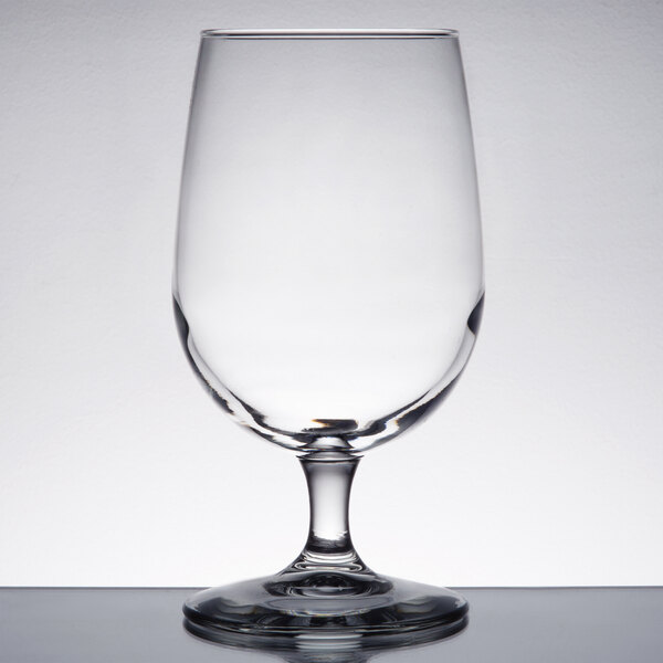 A close-up of a clear Libbey Vina wine goblet on a table.