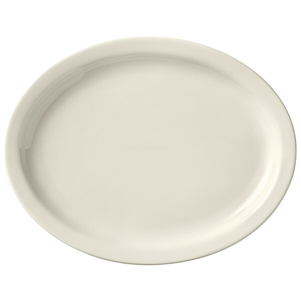 A Libbey Porcelana white oval platter with a narrow rim.