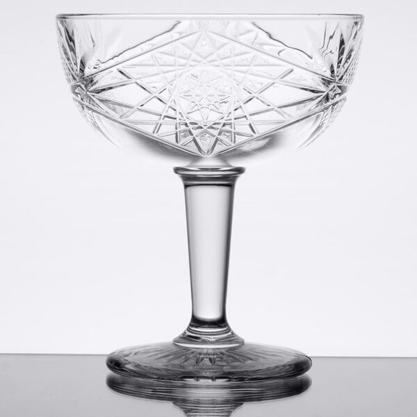 A Libbey coupe cocktail glass with a star design on the bowl.