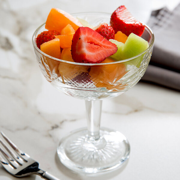 A Libbey coupe glass filled with fruit.