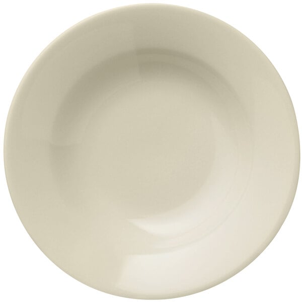 A close up of a Libbey Porcelana Cream white porcelain deep soup bowl with a wide rim.